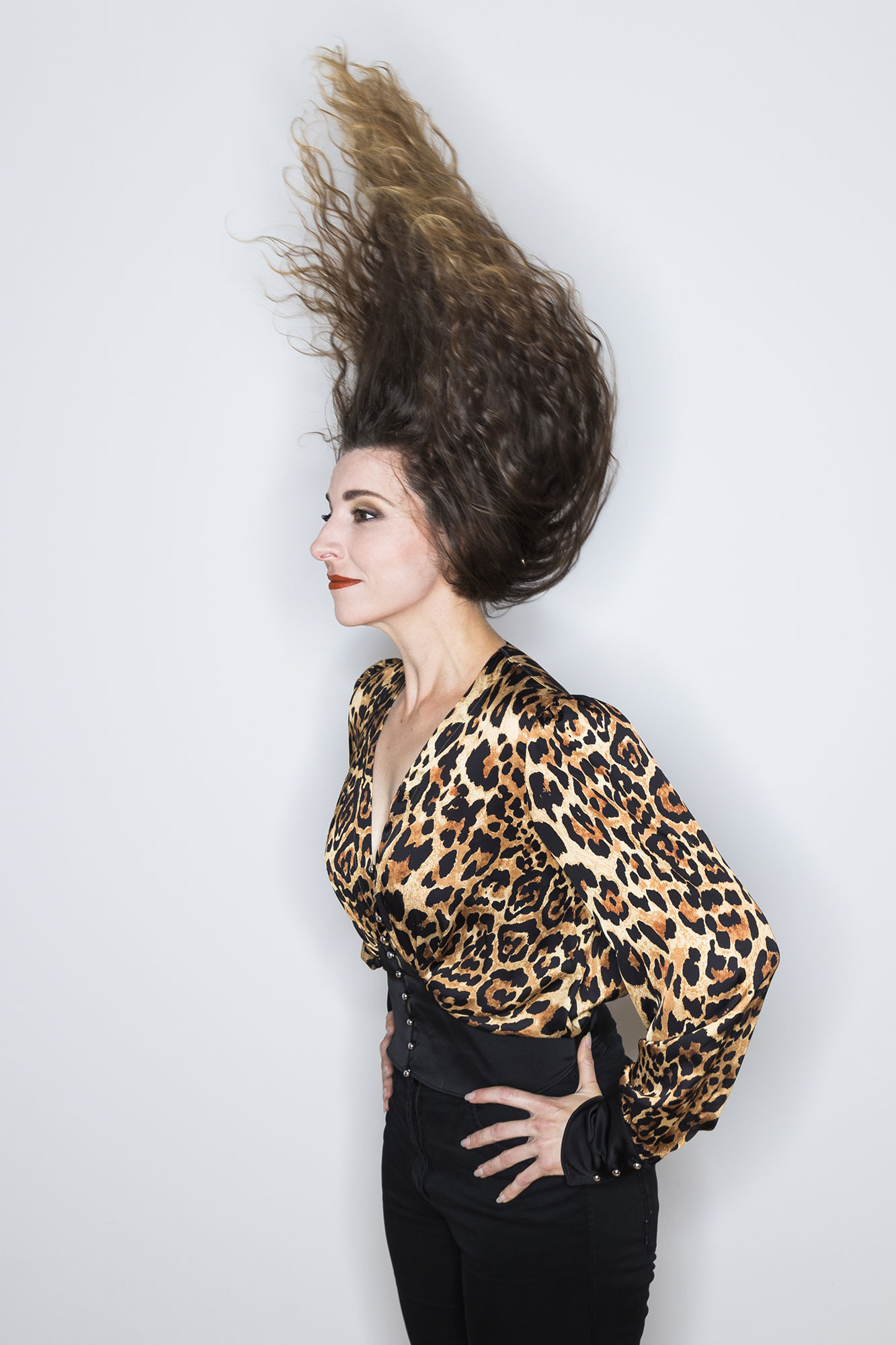 Picture of Eve-Maud Hubeaux in leopard top and hair in the wind